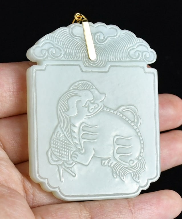 An Inscribed White Jade Plaque Qing: In square shape, one side incised a beast, the other side incised with Chinese characters, 5.8x4.4cm 清 白玉獸紋文字牌 Click here for natural