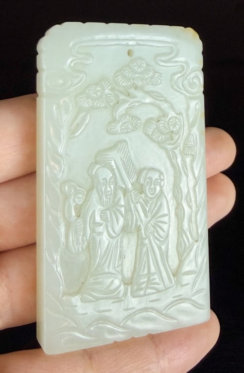 A White Jade Plaque Qing: Of rectangular form, each side carved with figural story scene, 6.9x4cm 清 白玉雕人物方牌 Click here for natural light photos