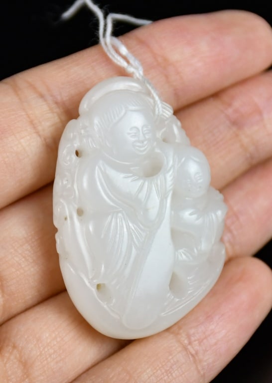 A White Jade Figural Carving Qing: A white jade carved figurine, the stone in clear white color tone, L:3.85cm 清 白玉人物雕件 Click here for natural light photos