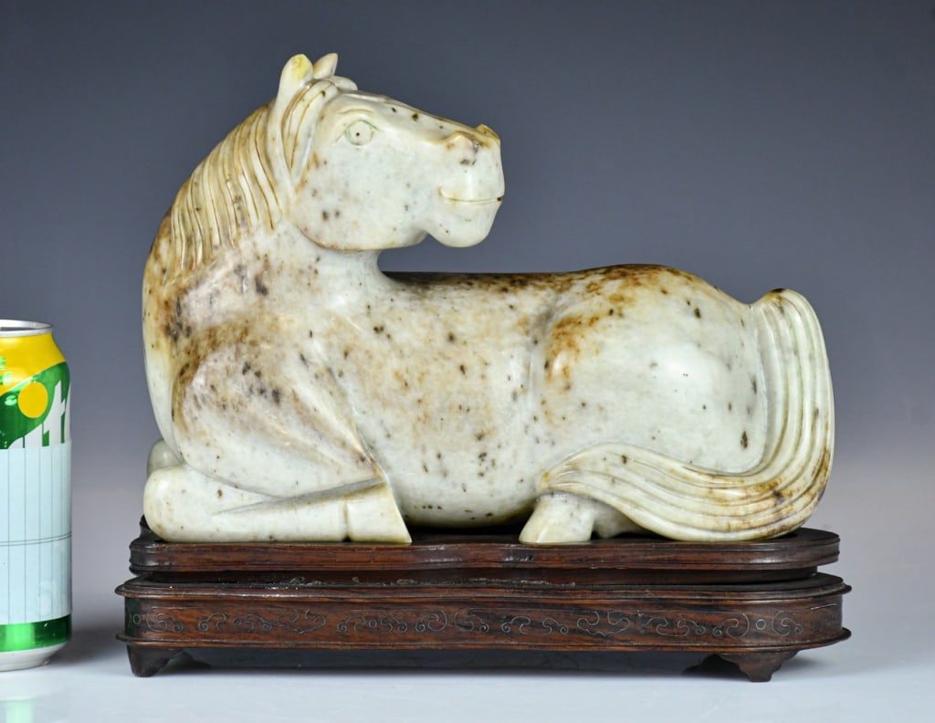 A Large Jade Stone Carved Horse w/Std Republican: Carved recumbent with legs tucked beneath the body and the head turned sharply over the back, the stone in white and russet tone, W:26cm, H:17.5cm 民國 玉石雕大!