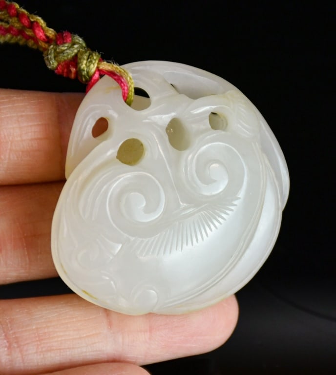 A White Jade Lingzhi Carving Qing: A double-Lingzhi carved from a nice white jade, D:4.5cm 清 白玉雕雙靈芝把件 Click here