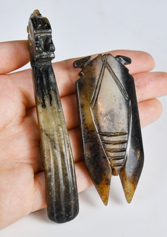 Group of 2 Archaistic Jade Carvings w/Box: Carved of cicada with protruding eyes, the stone with russet inclusions; the other of curved shaft form and terminating in a dragon head, the underside carved with a round button. Larger: 9.1x1.1cm &#