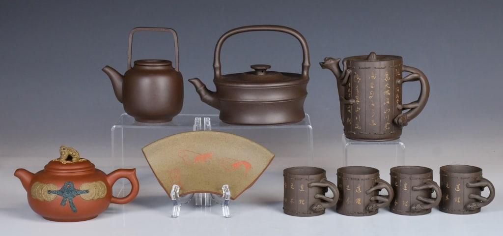 Group of Assorted Zisha Wares 20thC: Comprising 3 Zisha teapots, an individual set zisha teawares, and a zisha hanging decorated piece, each in various shapes, styles and colors. the largest D:16cm, H:11.5cm 20世紀