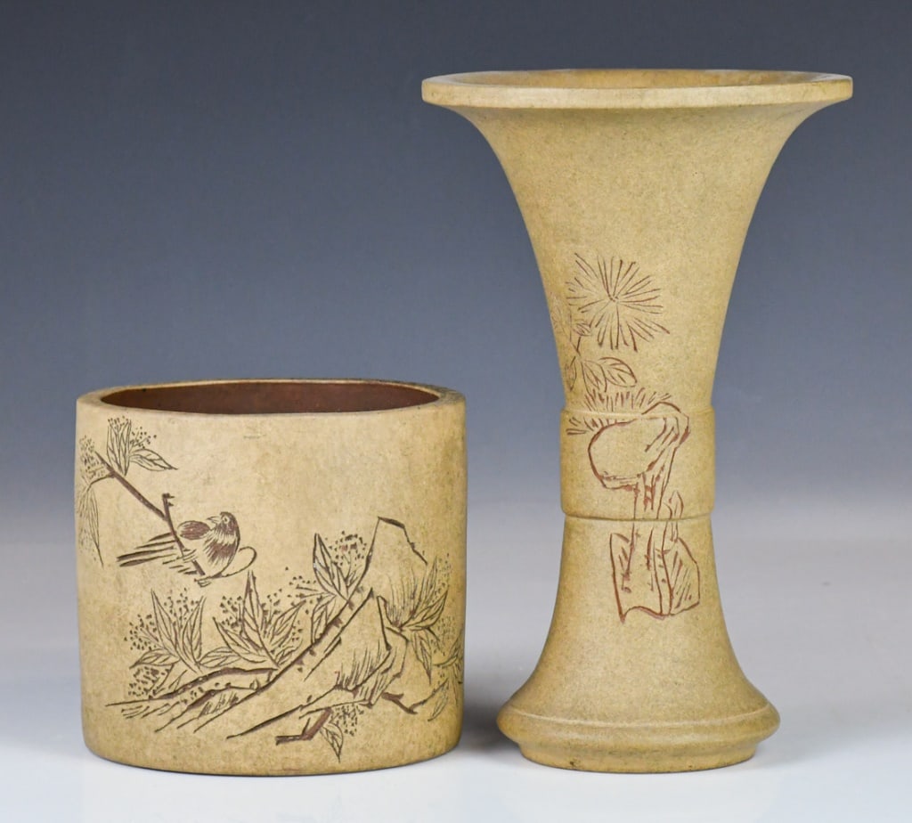A Zisha Brush Pot & A Zisha Vase Republican: Comprising a Zisha brush pot and a Gu vase, in similar colors and styles, the brush pot D:14.5cm, H:13cm; Vase H:25cm 民國 刻紋紫砂筆筒及紫&