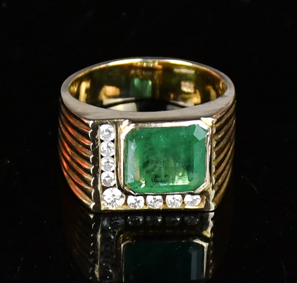 18K Gold Emerald Diamond Ring: One stamped 18K yellow gold casted emerald and diamond ring contains an emerald cut bezel set Emerald and 9 round brilliant cut channel set natural diamonds, size:US 8. Comes with certificate. 18K%
