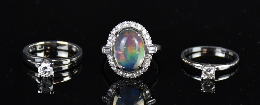 3PCs Platinum Diamond Rings (one w/Opal Stone): Comprising a stamped platinum casted 4-prong solitaire ring contains 1 round brilliant cut prong set natural diamond, size: US 6.5; a stamped platinum 226 casted 4-prong solitaire ring contains 1