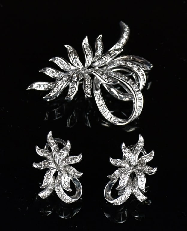 18K White Gold Casted Diamonds Brooch & Earrings: Comprising 1 stamped 18K white gold casted diamonds in flower brooch contains 68 single cut bead set natural diamonds; then a pair of stamped 18K white gold casted Omega clip & post back diamond