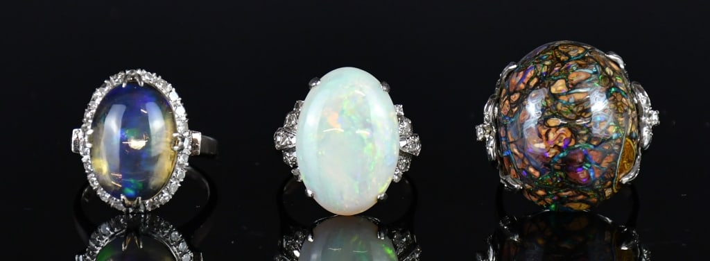 3Pcs 18K White Gold Casted Opal & Diamond Rings: Comprising 1 stamped 18K white gold casted rock with opal center cocktail ring contains 1 oval cabochon cut prong set rock with opal, 24 single cut prong set natural diamonds; 1 stamped 18K white gold