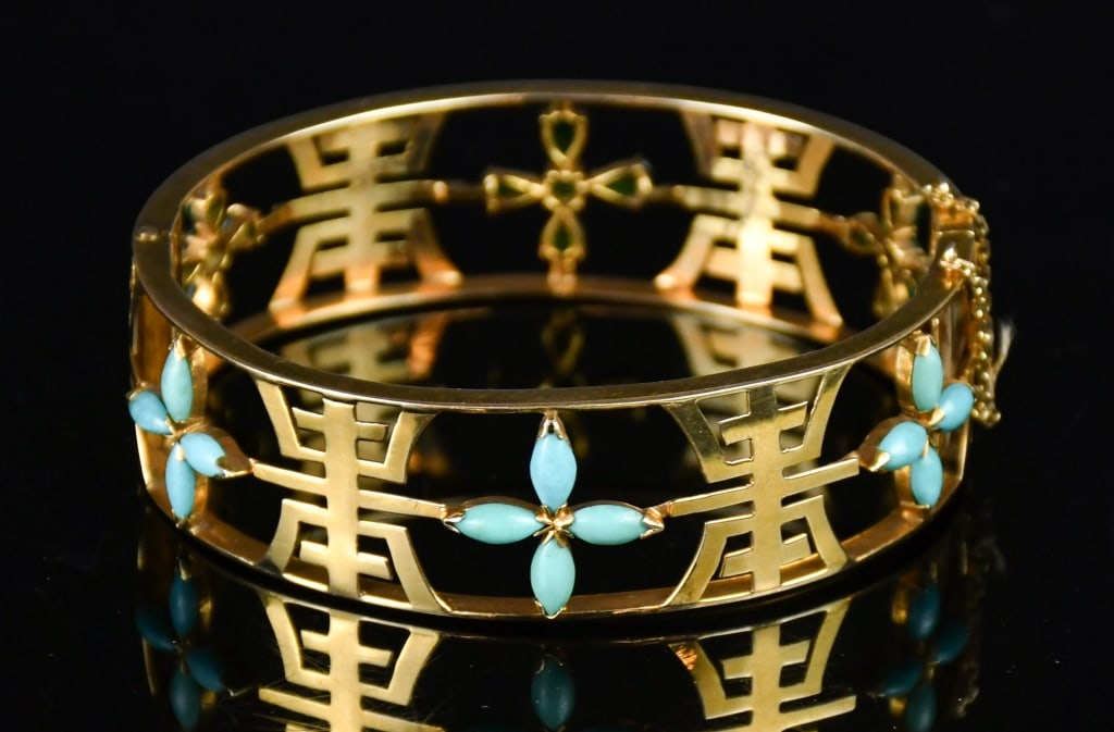 14K Gold Openwork Shou Pattern Gemstone Bangle: An exquisite 14K gold bangle, with openwork Shou pattern, adorned with jade and turquoise cross flowers, with clasp and safety chain. 6.2x5.5x1.9cm, total weight approx:26g 14K金鏤空