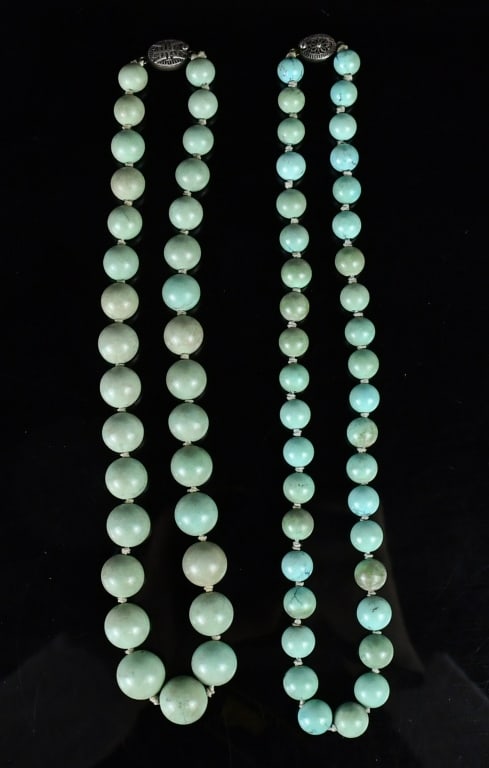 2 Turquoise Bead Necklaces: The first a single strand composed of 31 graduated, knotted round turquoise beads, measuring approximately 10mm to 15mm in diameter; the second a single strand composed of 39 uniform, knotted round tu