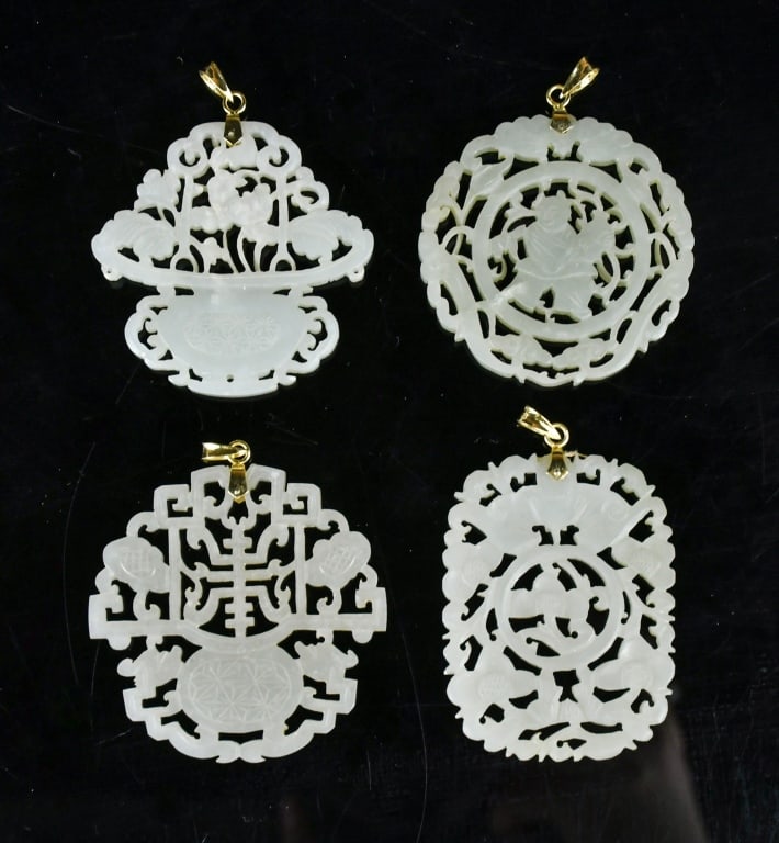 4 Reticulated Jade Pendants w/14K Gold Bails Qing: Of flattened circular or rectangular forms, carved in openwork in various themes, each top is pierced with an aperture and mounted with a 14K gold bail. The largest L:5.8cm 清 14K金透