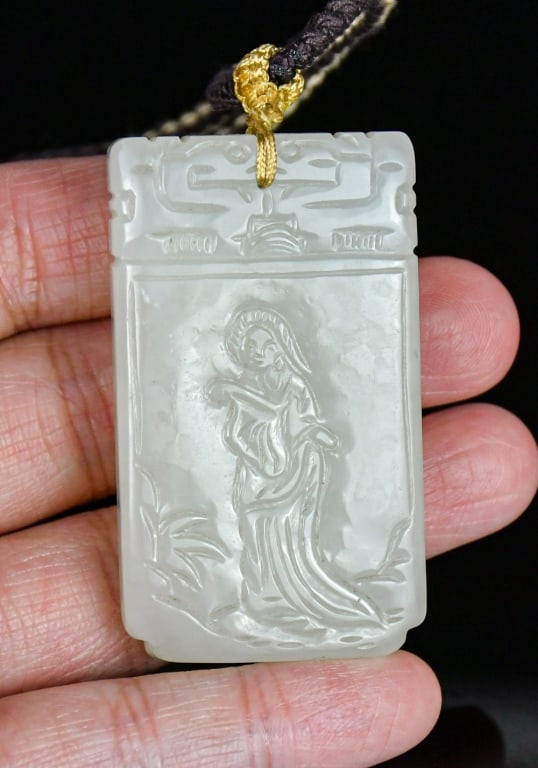 A White Jade Carved Plaque Qing: A jade carved rectangular plaque, with incised figural pattern on one side and character on the other side, the stone overall in translucent white color tone. 3x5.2cm 清 白玉刻