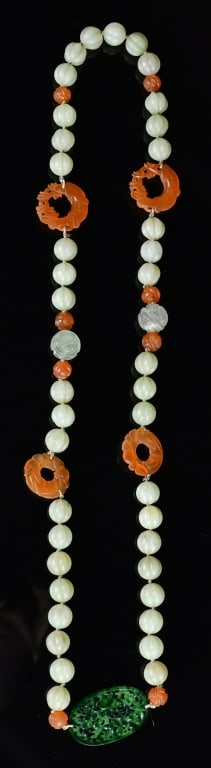 A Jade Beads & Agate Necklace Qing: The necklace comprised with melon shape jade beads, agate beads and fish ornaments, and a reticulated jadeite pedant, the total L approx:70cm 清 青白玉瑪瑙項&