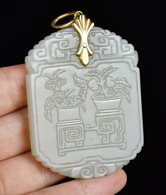 A Carved White Jade Plaque: The large, flattened rectangular plaque features a scalloped lower rim and is topped with an archaistic fretwork crest. It is finely incised in low relief on the front with a bogu (antiquities) motif,