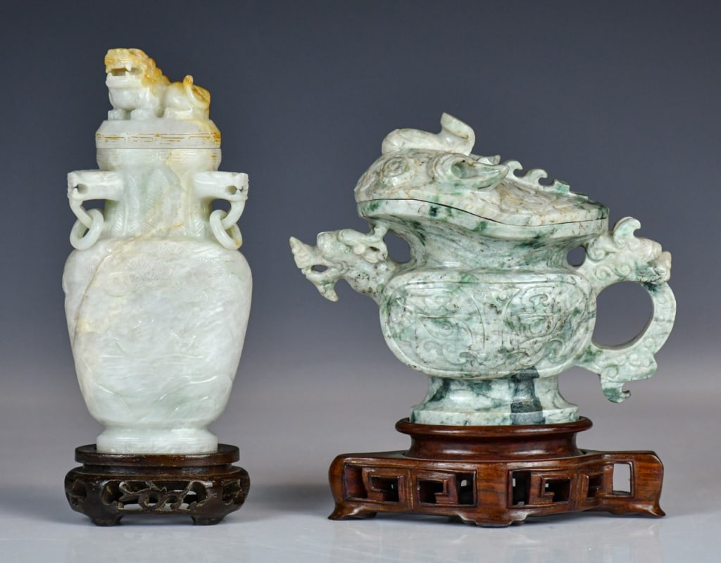 A Group of 2 Jadeite Covered Vases w/Stds 1950-70s: One of baluster form surmounted by a beast finial and set with a pair of dragon-head handles; the other carved with dragon heads. Larger H:15.3cm. Each comes with stand. 建國期 Ň