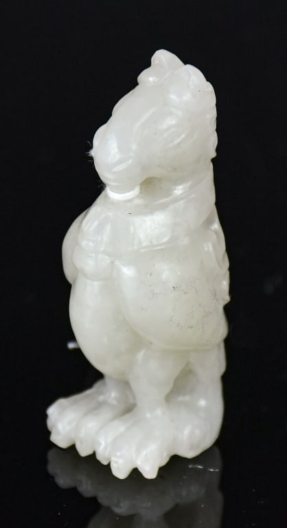 A White Jade Carved Beast Republican: Carved as a composite mythical beast with features of various animals, the stone overall of white tone. 6x2.5cm 民國 白玉雕瑞獸把件