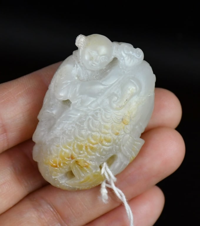 A White Jade Carving of Child & Fish (1 of 6)
