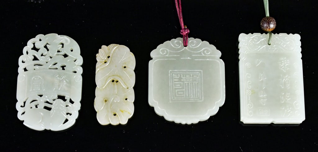 Group of 4Pcs Celadon Jade Incised Plaques: Comprising 4 pieces plaques in various shapes and styles, the stones overall in white to light celadon tone. The largest one:4x6cm 青白玉牌一組4件