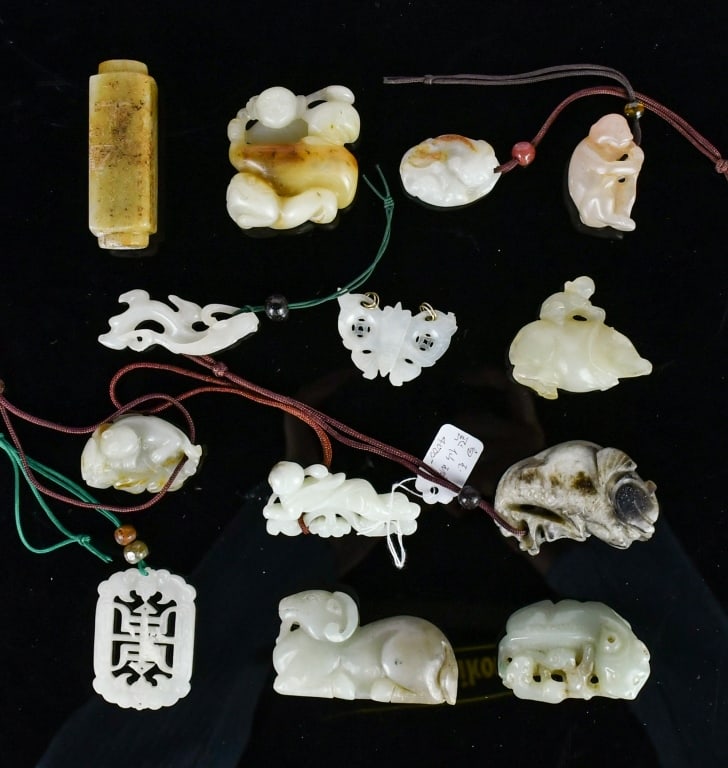 Group of 13 Jade Carved Ornaments: Comprising 13 pieces jade carvings in various colors, shapes and styles. The largest L: 6cm 各式玉雕件一組13件