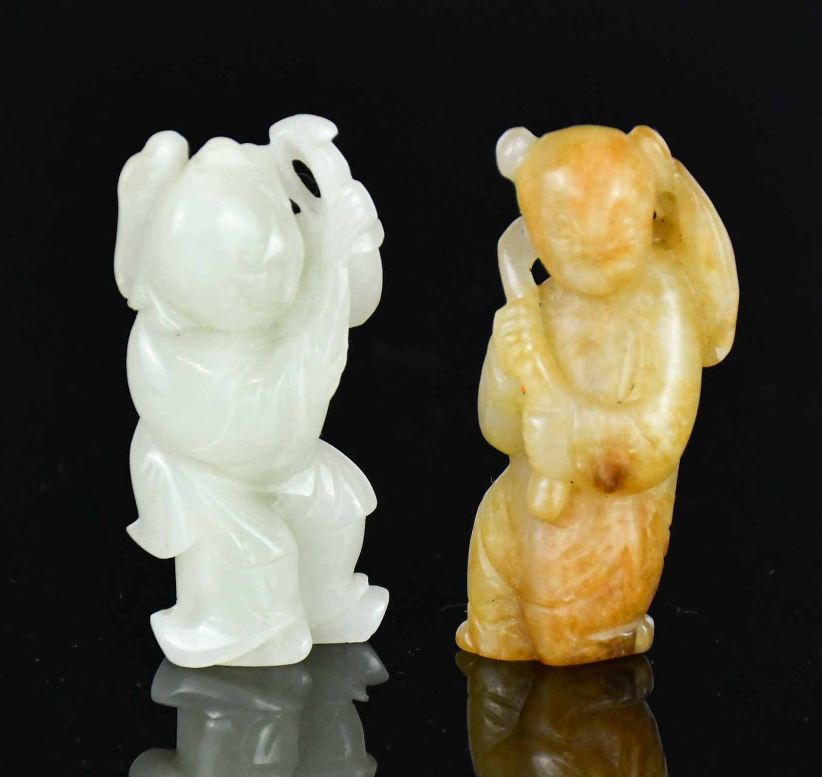 Group of 2 Jade Carved Figures Qing: Comprising two jade carved ornaments, each depicting a child, the larger 4.7x2.4cm 清 玉雕童子一組2件