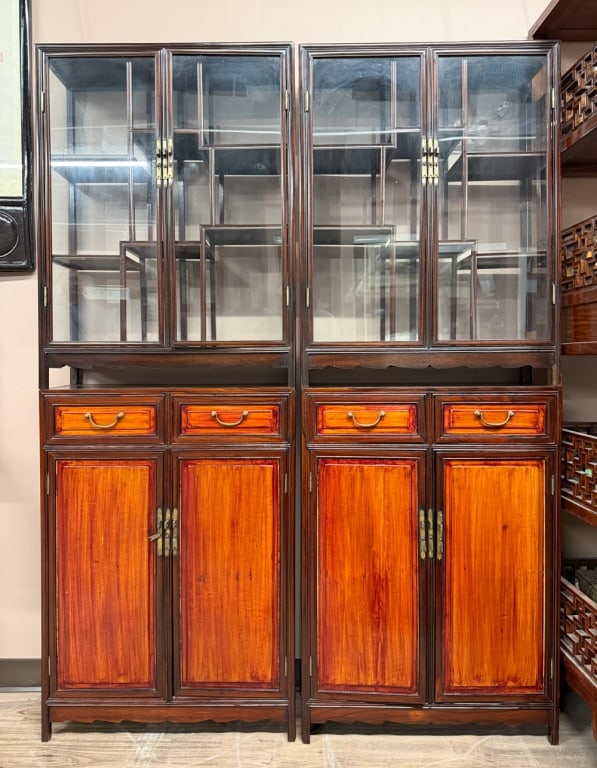 Pair of Hardwood Display Cabinets Republican: Each of rectangular form, the upper section fitted with a pair of glazed panel doors enclosing an asymmetrical arrangement of open, stepped shelving designed for the curated display of scholar's objec