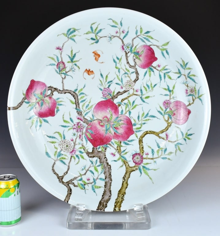 A Lrg Famille Rose Peach Dish Qianlong Mk Qing: Potted with shallow rounded sides and a gently depressed centre, both the interior and exterior are painted with fruiting peach tree amidst blossoms and bats, six character Qianlong mark at the base. 