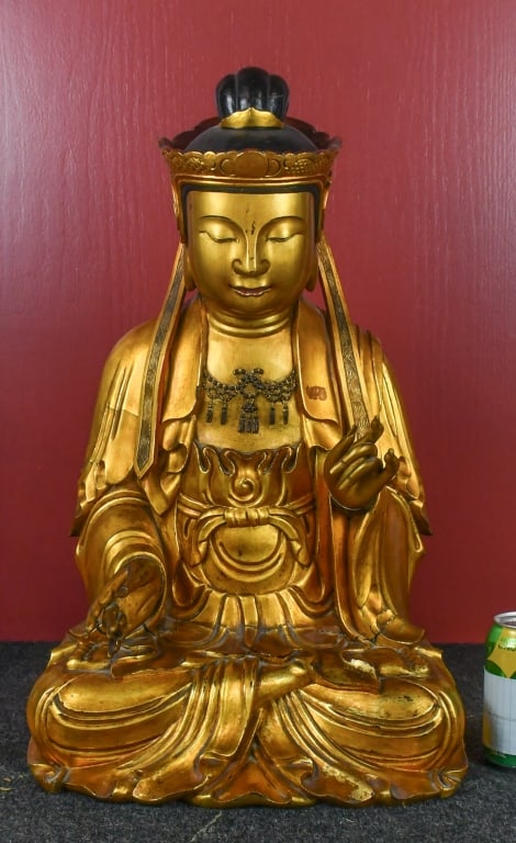 Lacquered & Gilt-Wood Figure Of Guanyin 17-18thC: The bodhisattva is elegantly carved, seated in meditative posture. The rounded, serene face features downcast eyes and an introspective expression, flanked by long earlobes. The head is surmounted by 