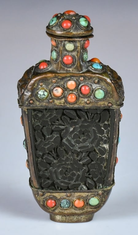A Turquoise-Inlaid Brass Snuff Bottle 19thC: An antique Chinese metal snuff bottle decorated with turquoise and coral stones, and with auspicious lion head motifs inspired from Tibetan art. H:10cm 19世紀 嵌松石Ɩ