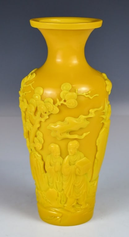Carved Imperial Yellow Peking Glass Vase Republic: Potted with an ovoid body tapering down to a flat base and rising to a tall, waisted neck with a wide flared mouth rim. The thick glass is of imperial yellow tone, deeply carved around the body in hig