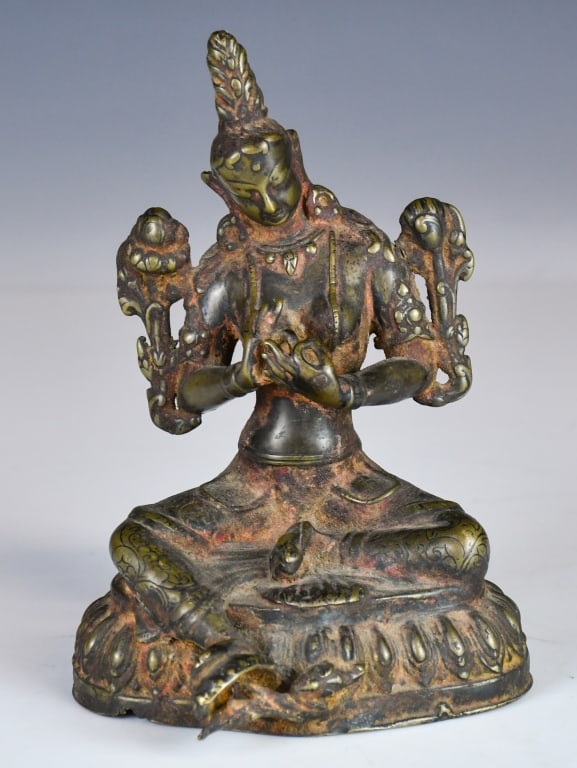 A Gilt-Bronze Buddha Statue Qing: A gilt-bronze figure of a seated Buddha upon a lotus base, with hands held before the chest in a contemplative gesture. H: 7cm, weight approx: 800g 清 鎏金銅佛像 &#