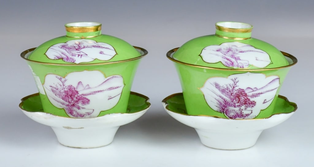 Pair of Apple-Green Ground Covered Cups Republican: A pair of covered teacups with saucers, each painted with landscape within open-windows against a bright apple-green ground, a mark at the cup's bottom. Saucer D:10.5cm, total H of a set:10.5cm ૎