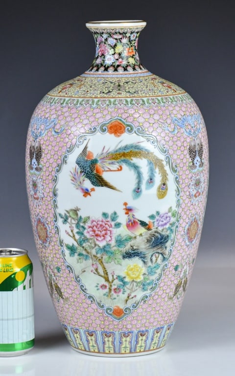 A Pink-Ground Vase Qianlong Mk 1950-70s: Of a narrow mouth, to a bulging shoulder then tapered down to a flat foot, painted to the exterior with flowers and birds on a pink ground, with a four-character Qianlong mark at the base. H: 39.8cm &