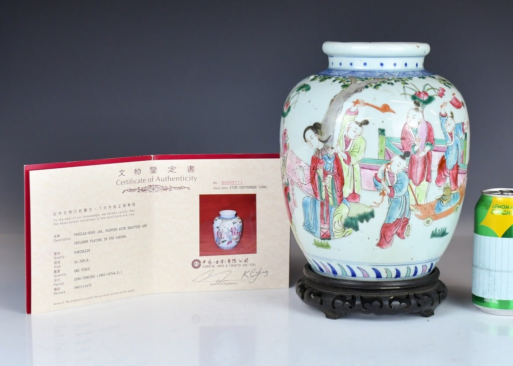 A Famille Rose Jar Qianlong Mk w/Std & Certif Qing: The ovoid body rising to a short-waisted neck with a lipped rim, decorated with children in a garden scene, four-character Qianlong mark at the base, comes with certificate. H: 23.5cm 清 粉