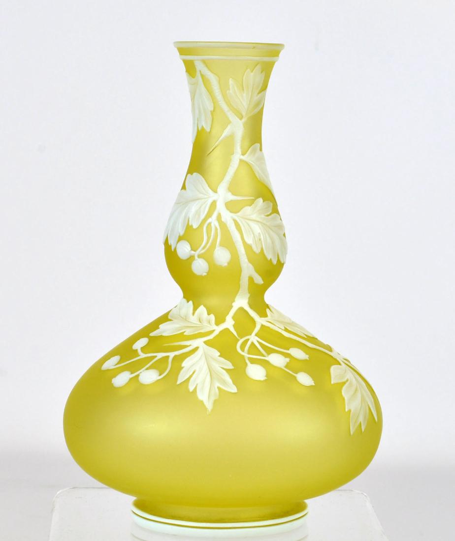Thomas Webb & Sons Cameo Glass Vase: Lemon yellow vase with white overlays of vines and berries. Marked on base. Bulbous body with tapered neck. 6.5"H X 4"W. See photos. In house shipping continental U.S. $35 plus insurance. The absence