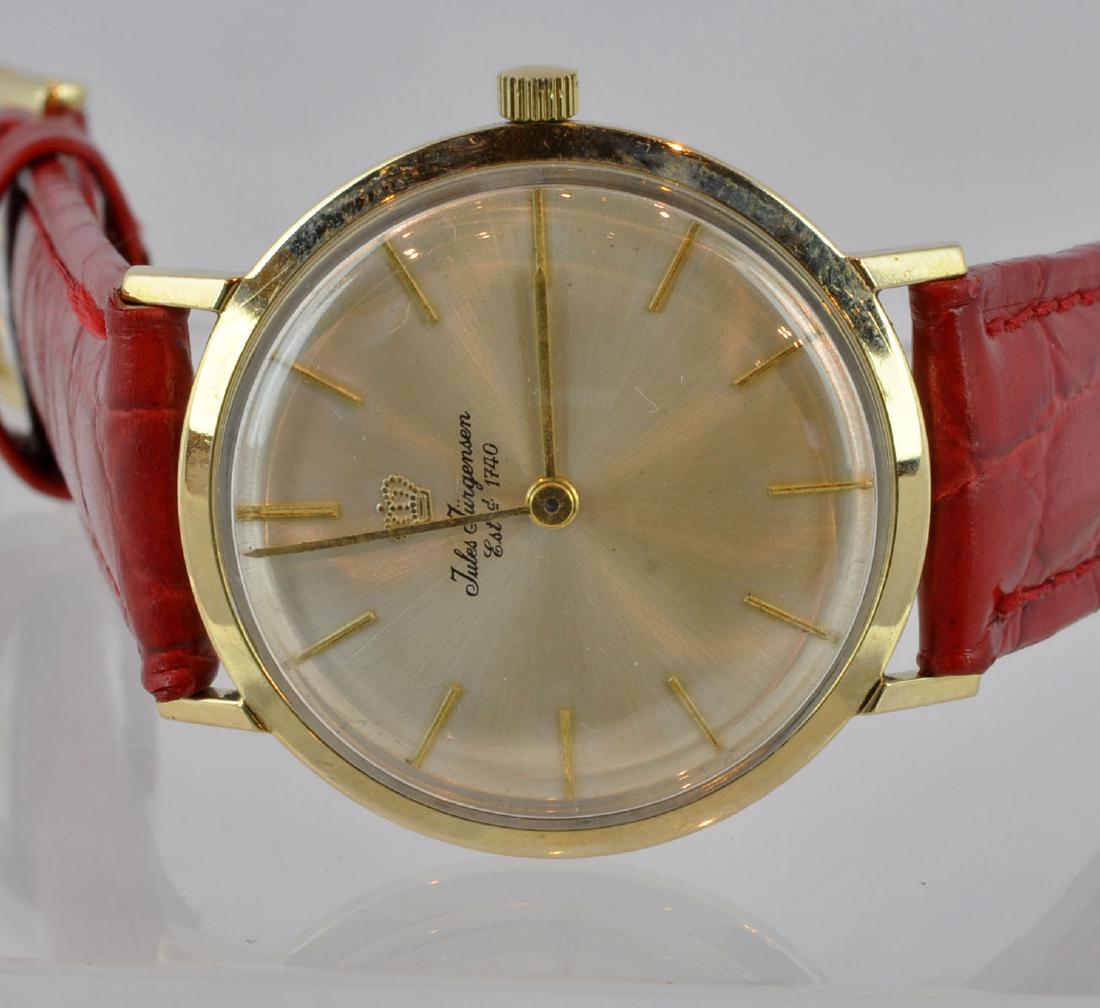 Jules Jergensen 14Kt Gold Watch: Jules Jurgensen watch, marked 14kt on back. Italian red leather band. Face measured from outside edge of crown 35mm; band 7.75". Working condition. See photos. In house shipping continental U.S. $25 p