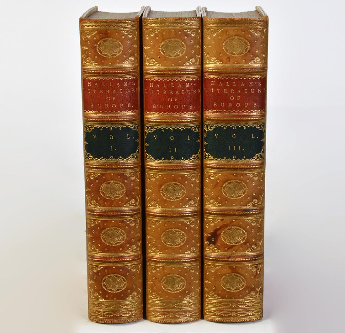 3 Volumes by Henry Hallam "Literature of Europe": Covering European literature of 1400's, 1500's & 1600's in 3 light brown leather bound volumes. Published by John Murray, London, 1854. Measures 8.75"H x 6"W. Tight bindings, good condition, slight to