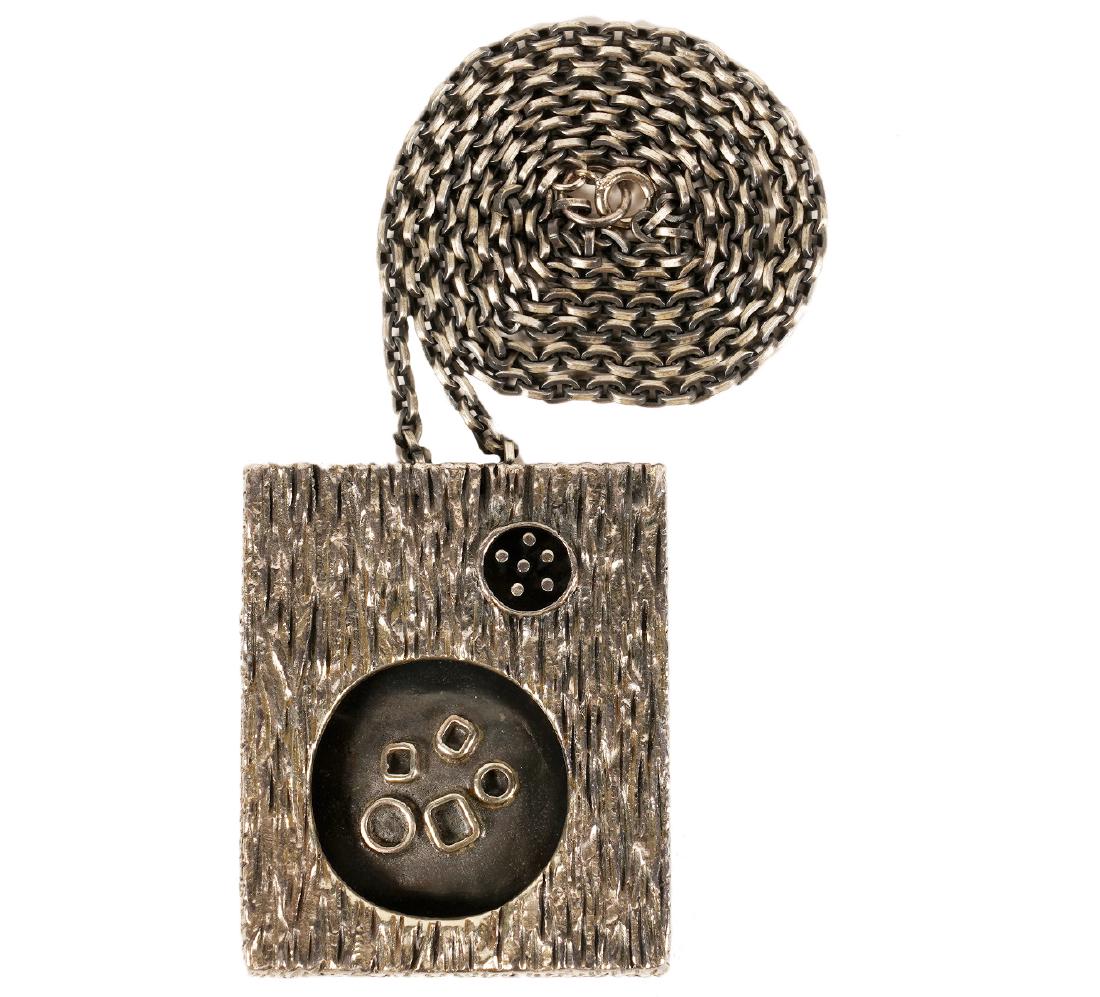 Guy Vidal Reverse Shadow Box Pendant: Guy Vidal rectangular reversible shadow box pendant on 28" chain. Both sides have different forms and elements; can be worn either way. Measures 2.25"H x 1 7/8"W x .5"D. Good condition, see photos. Ex