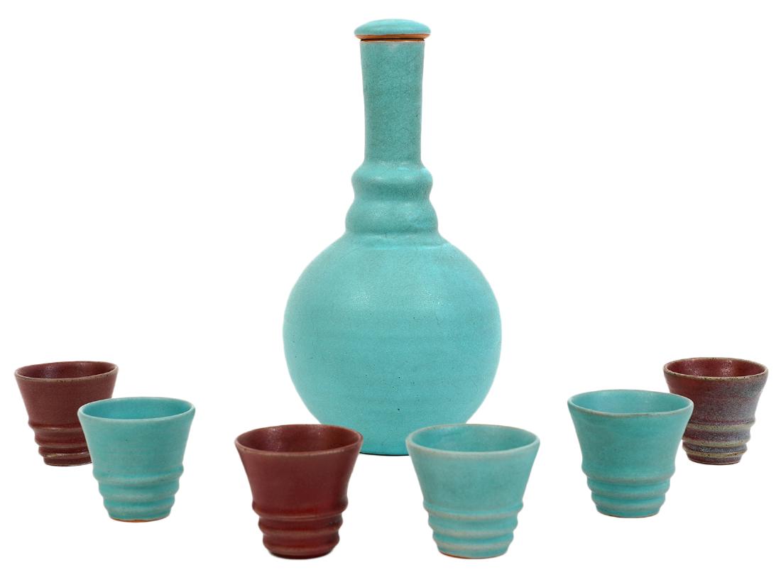 Kjeld and Erica Deichmann Wine Carafe & Glasses: Kjeld and Erica Deichmann ceramic wine carafe and 6 glasses. Signed on bottom. Very good condition. Carafe is 9.5" H and the glasses are 2" H. Examine all photos closely. Contact AAG for more detailed