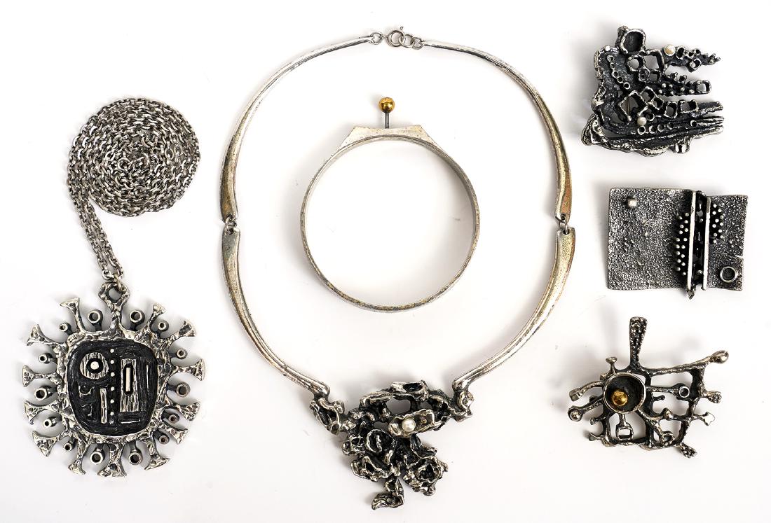 6 Pc. Guy Vidal Assortment: Guy Vidal assortment includes signed large pendant on chain, articulated necklace, 2 biomorphic pins/brooches, bangle, pin with 2 pearls. Good condition, see photos. Examine all photos closely. Contac