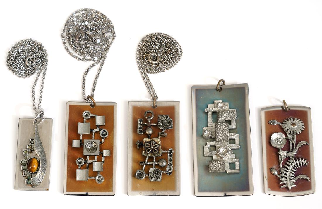 5 Architectural Pendants by Jean Luc Morin: Jean Luc Morin geometric modernist pendants with architectural details, signed on back. 3 pendants on 24" chains. Good condition, see photos. Examine all photos closely. Contact AAG for more detailed 