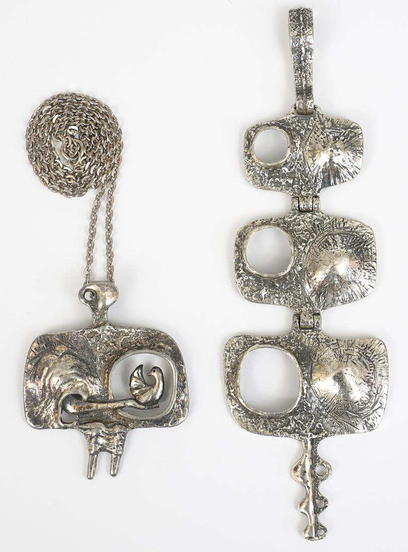 Guy Vidal Articulated Pendant & Bird Pendant: Large Guy Vidal articulated 'Volcano' pendant (no chain); woman & bird pendant with chain. Good condition, see photos. Examine all photos closely. Contact AAG for more detailed information if needed. 