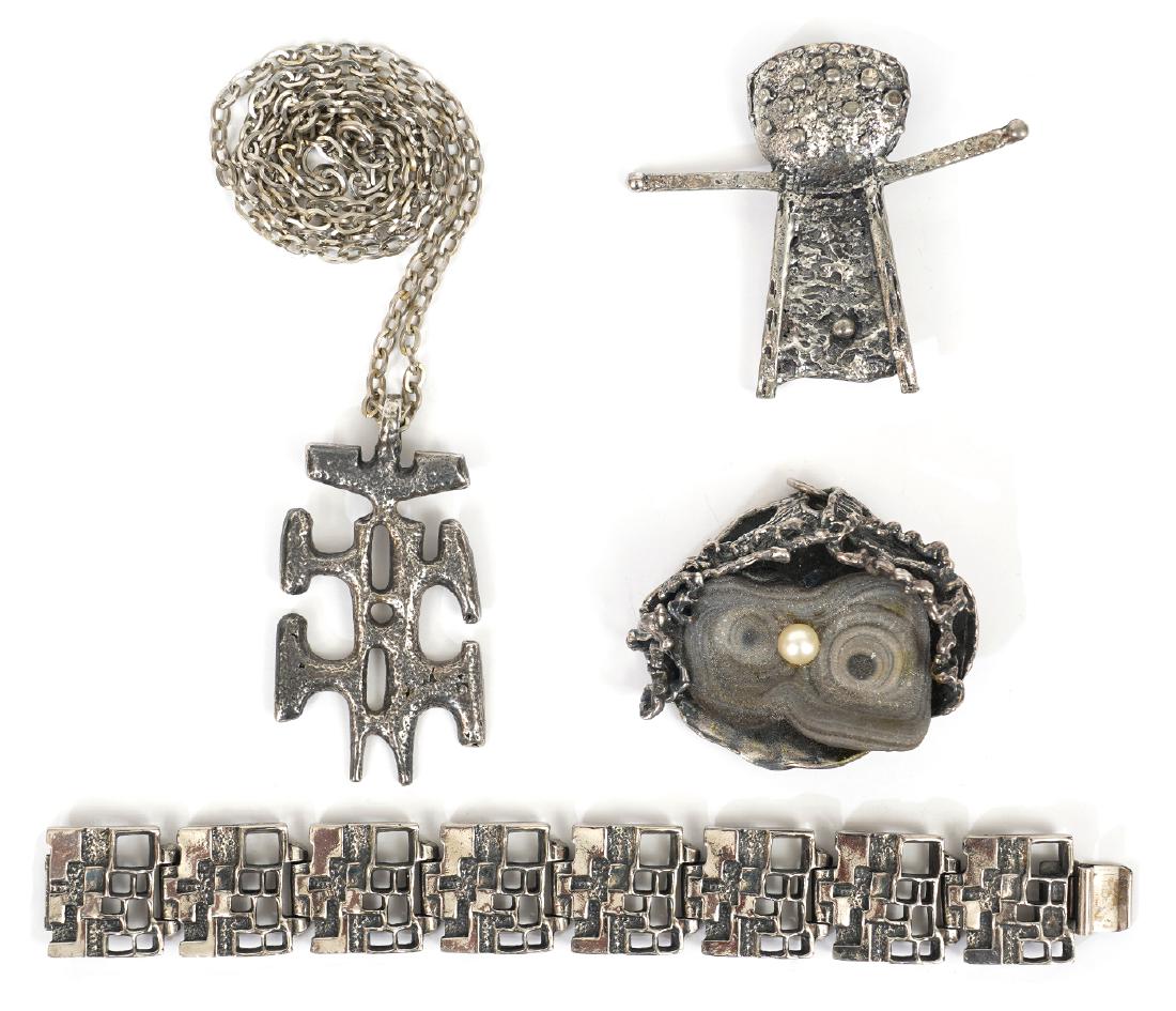 Robert Larin Bracelet, Pin, & Pendants: Robert Larin 'Superman' pin, abstract character pendant with chain, 'Windows' paneled bracelet & 'Oyster' pendant attributed to Robert Larin. Good condition, see photos. Examine all photos closely. Co