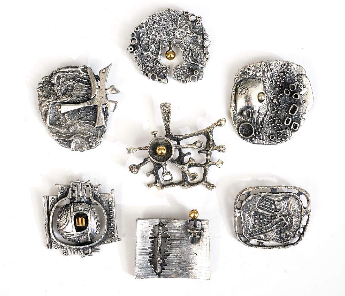 7 Guy Vidal Pins in Assorted Metal Finishes: 7 Guy Vidal brutalist and biomorphic pins, various sizes and finishes to metals. Good condition, see photos. Examine all photos closely. Contact AAG for more detailed information if needed. AAG is not