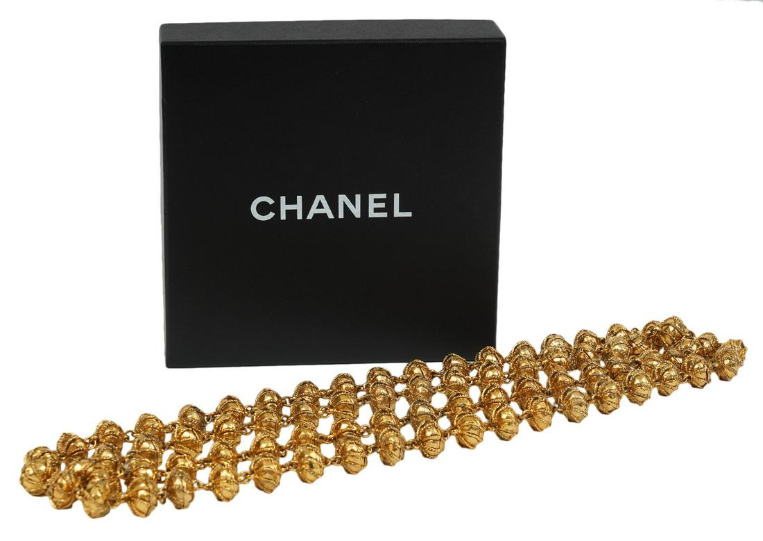 Chanel Gold Tone Byzantine Bead 64" Long Necklace: A stunning statement piece, this Chanel necklace is a long strand of gold tone beads, long enough to be wrapped several times. Each bead has intricate filigree work in a Byzantine style. This is a hea