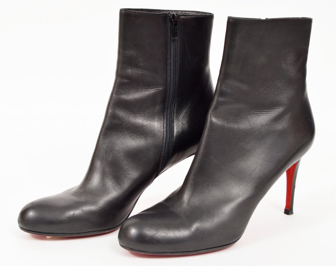 Christian Louboutin Black Ankle Boots 42: Christian Louboutin Black Ankle Boots, size 42 in black leather with iconic red bottoms. 3.75" heel. Condition report: Good, resoled, small scuff on one heel but does not pierce leather. Examine all p