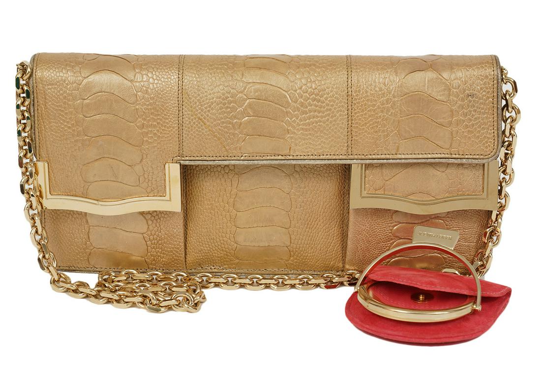 Judith Leiber Gold Snake Clutch Shoulder Bag: Judith Leiber gold snakeskin shoulder bag or clutch with removable strap. Lined in coral suede with 2 slip pockets and one zipper pocket inside. Included is a matching pouch with Judith Leiber hand mi