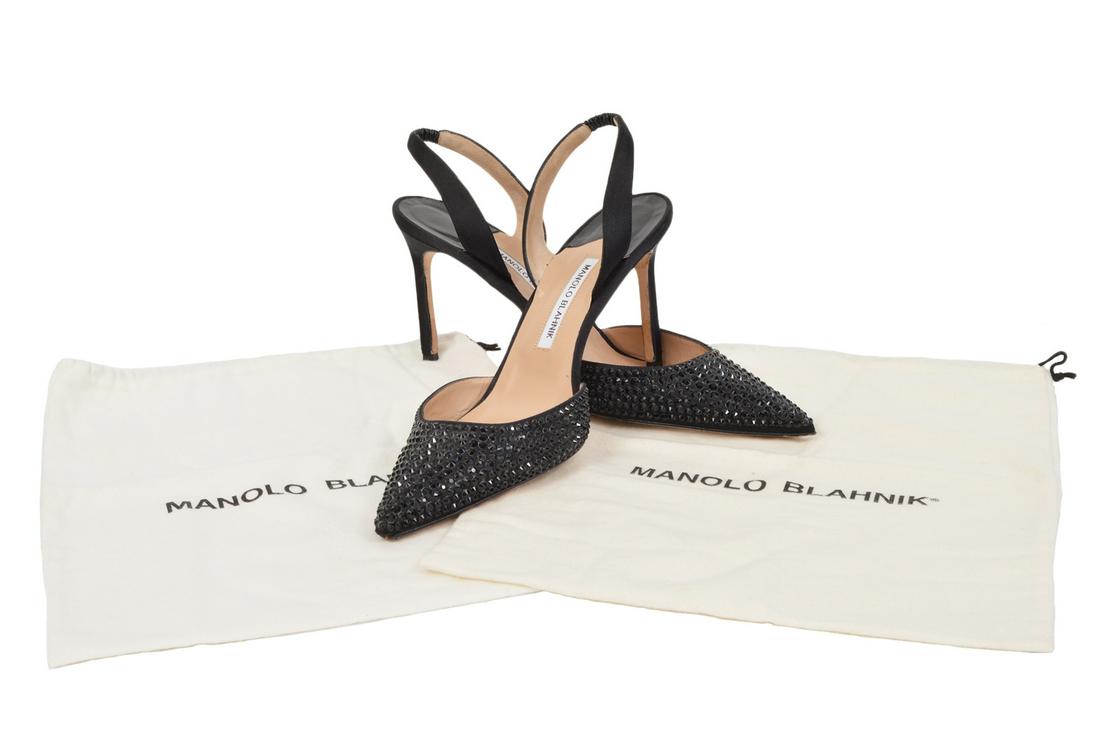 Manolo Blahnik Black Crystal Sling Back Pumps: Manolo Blahnik black satin sling back pumps encrusted with sparkling crystals. Size 42 - runs small. Condition report: Very good, light wear on soles - no issues, see photos. Examine all photos closel