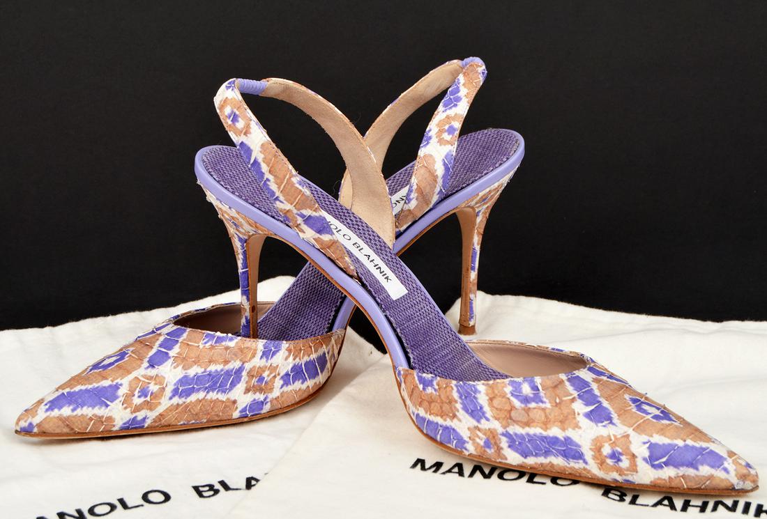 Manolo Blahnik Silver Snake Strappy Heels: Manolo Blahnik silver snake strappy heels in size 42 with 4" heel. Includes 2 shoe/bust bags. Condition report: Very Good - very light wear on soles, see photos. Examine all photos closely. Contact AA