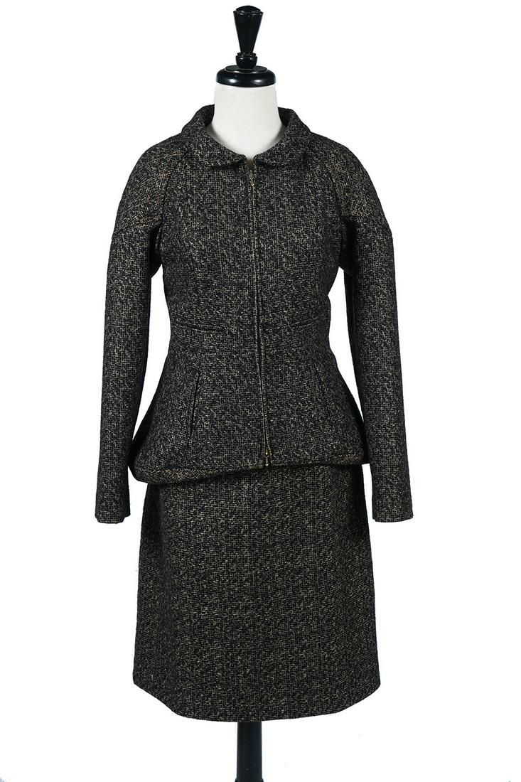 Chanel NEW Black & Gold Wool Tweed Skirt Suit: Chanel black & gold wool tweed suit with blazer and A-line skirt, size 42. Highly styled jacket with quilted shoulders and button back peplum. Matching Chanel buttons with black & gold enameled CC's. 