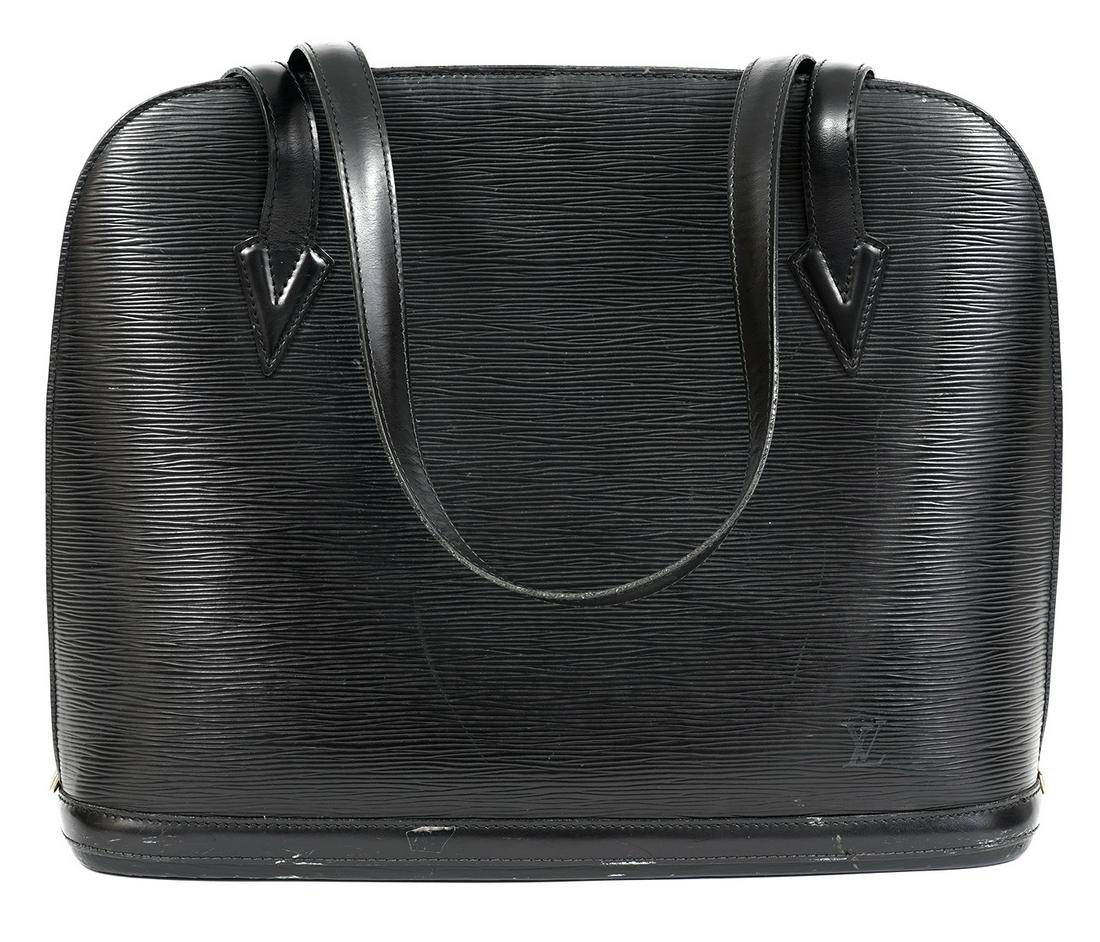 Louis Vuitton Loussac Noir Epi Tote Shoulder Bag: Black Epi Louis Vuitton Loussac tote/shoulder bag with zip top closure and brass hardware. This bag has dual flat shoulder straps, embossed logo at front corner, tonal Alcantara lining. The interior h
